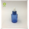 Packing beard oil empty mockup cosmetic serum bottle blue essential oil glass bottle with dropper cap